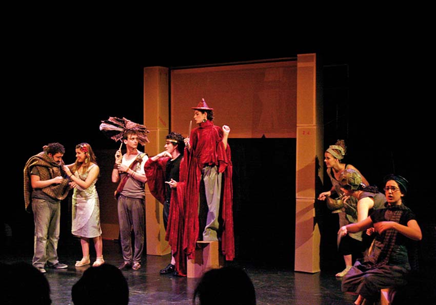 Group of actors and actresses performing on a stage